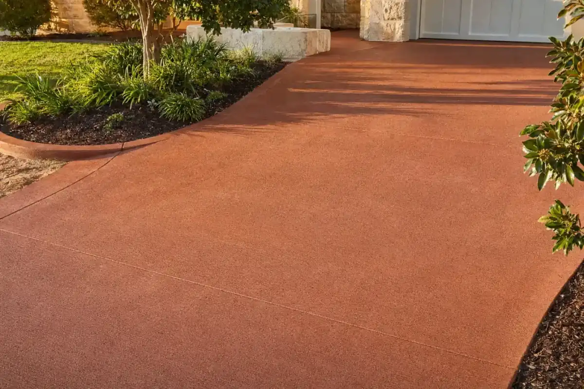 Coloured terracotta-tone concrete driveway in Perth